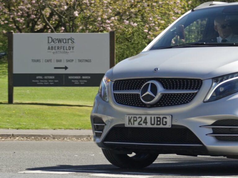 Tour vehicle leaving Dewars Distillery after tour and tasting experience
