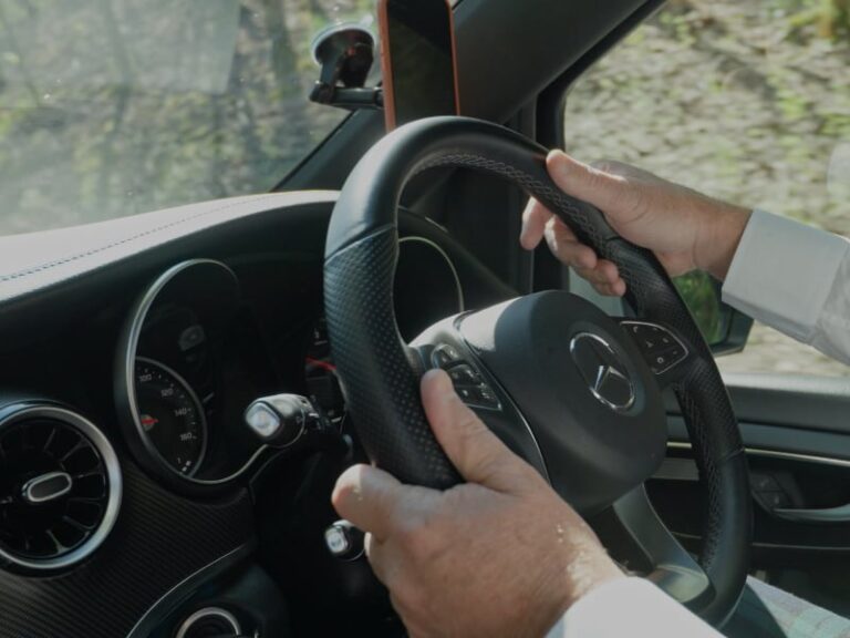 Driver at the wheel of a Mercedes V Class private tour vehicle