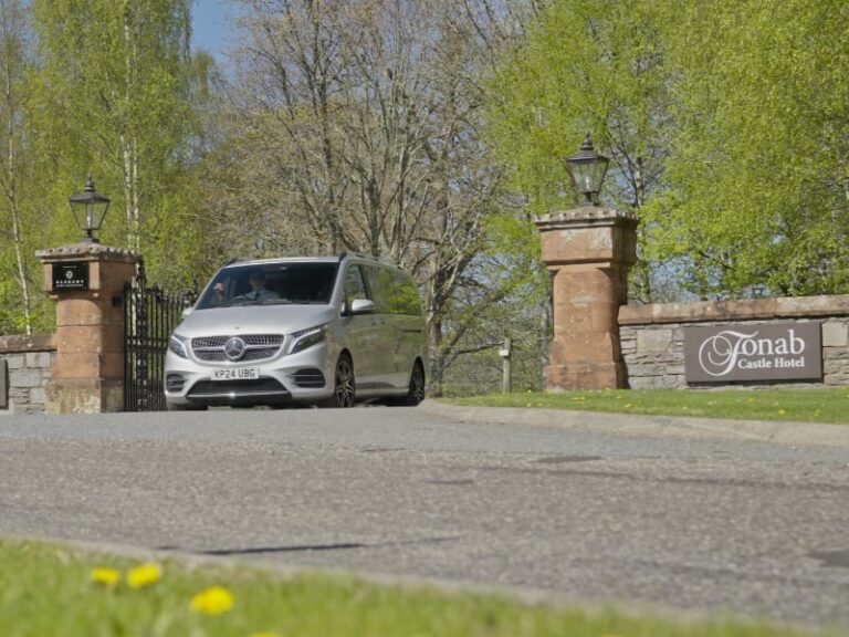 Mercedes V Class leaving the impressive Fonab Castle Hotel driveway