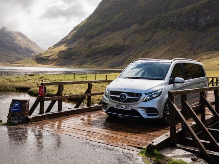 Tour vehicle traversing local wooden bridge