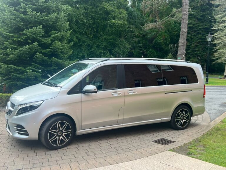 Mercedes V Class acquired by Pitlochry Transfers & Tours on driveway with woodland backdrop