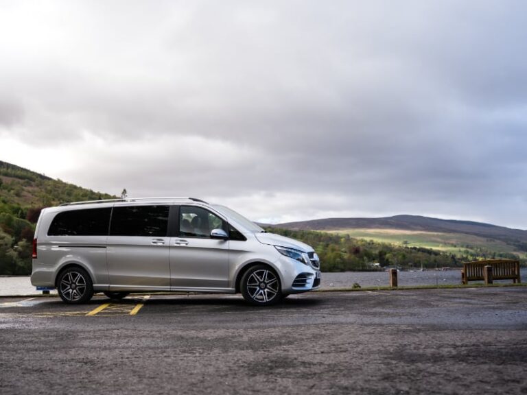 Cloudy day but still with view across the loch and vehicle in parking area
